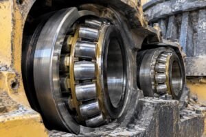 Close-up view of heavy-duty spherical roller bearings installed in a mining crusher housing
